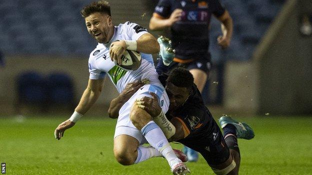 Ali Price is tackled by Edinburgh's Bill Mata