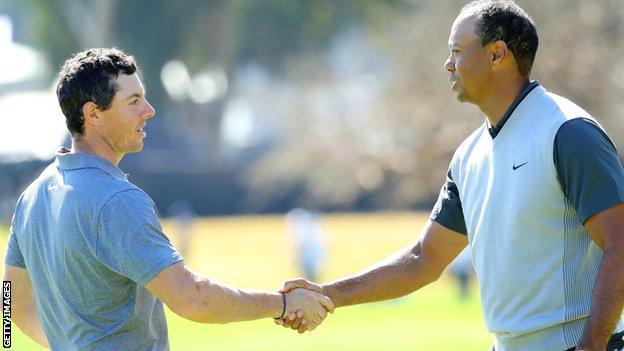 Rory McIlroy and Tiger Woods at the end of their opening round in California