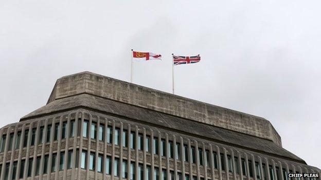 Sark flag flying over the Ministry of Justice headquarters