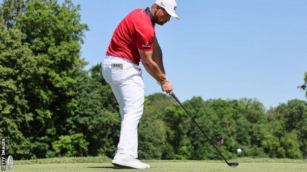 Bryson DeChambeau hitting a tee shot