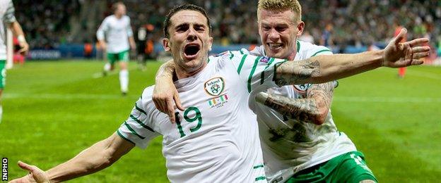 Robbie Brady celebrates with James McClean after hitting the Republic's winner against Italy