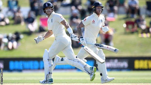 England batsmen Joe Denly (left) and Ben Stokes (right) look at the ball as they cross for a run on day one of the first Test against New Zealand