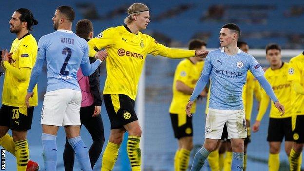 Erling Haaland and Phil Foden chat after the Champions League first leg