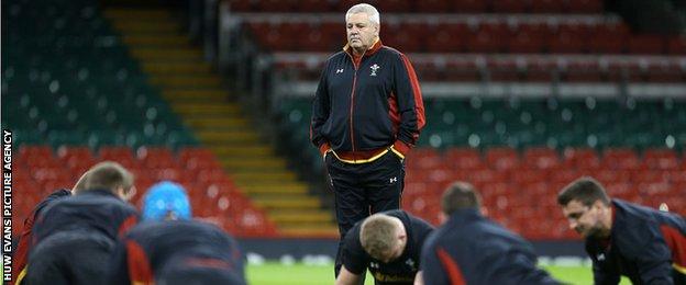 Warren Gatland watches the Wales team doing press-ups during a training session at the Millennium Stadium