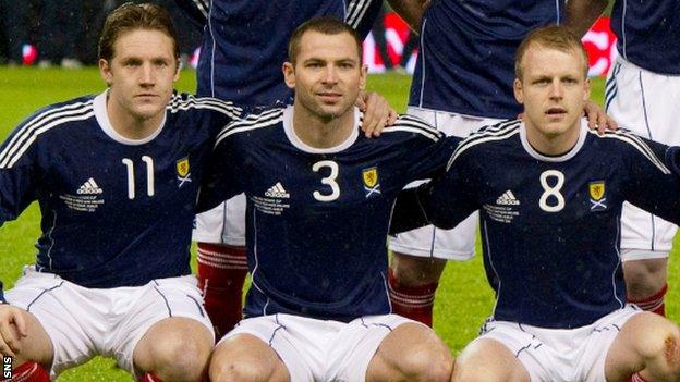 Kris Commons (left) and Steven Naismith line up for Scotland in 2011, either side of Phil Bardsley