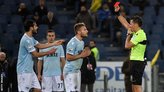 Piero Giacomelli gives Lazio's Ciro Immobile a controversial red card