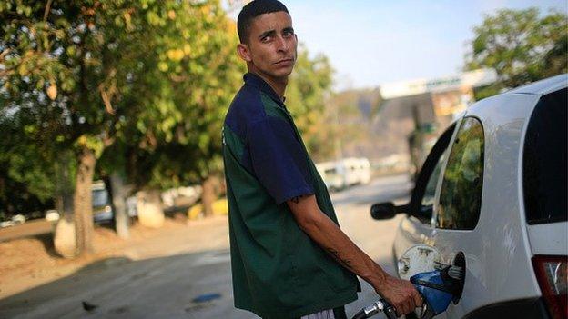 Man filling car up in Brazil