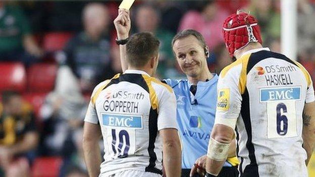 Jimmy Gopperth (left) was given a yellow card by referee Tim Wigglesworth at Welford Road, despite captain James Haskell's intervention