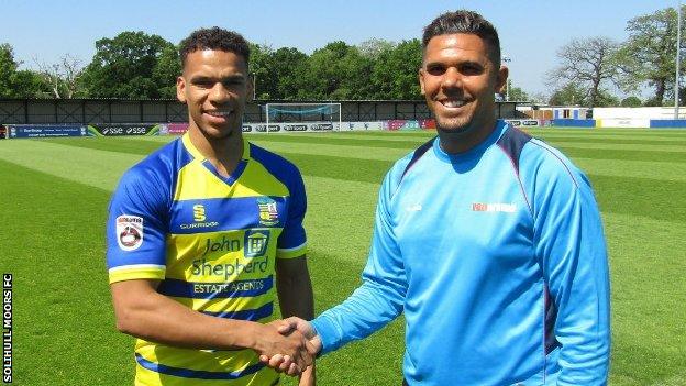 New signing Kalern Thomas is welcomed to Damson Park by Solihull manager Liam McDonald