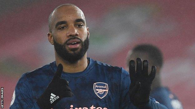 Arsenal striker Alexandre Lacazette signals after scoring against Southampton