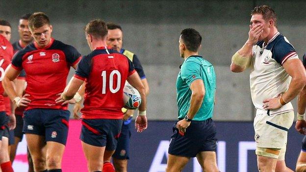 Owen Farrell looks on as John Quill leaves the pitch after being red carded