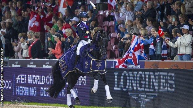 Charlotte Fry waves aboard Glamourdale after winning gold