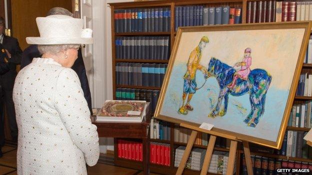 President of Germany Joachim Gauck presents the Queen with a painting of a horse