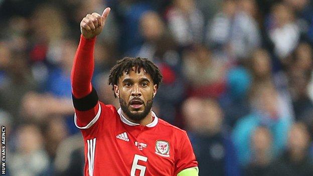 Ashley Williams acknowledges a team-mate