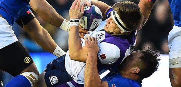 Scotland's George Turner is tackled against Samoa