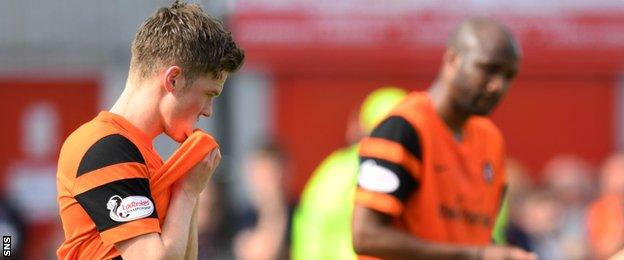 Dundee United midfielder Blair Spittal shows his disappointment against Hamilton