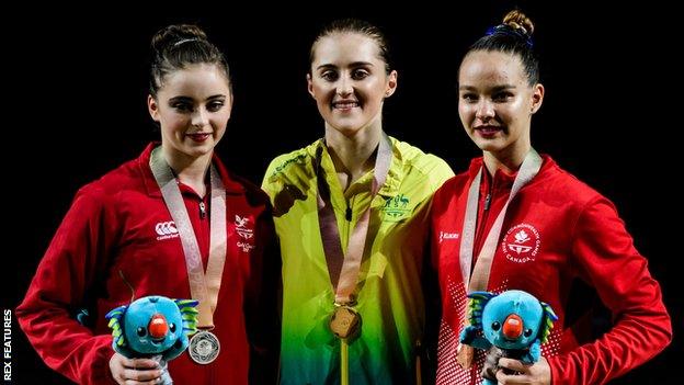 Alexandra Eade of Australia who won gold, Latalia Bevan of Wales who won silver and Shaman Olsen of Canada who won bronze in the Women's Floor Exercise Final on Day Five of the Gold Coast Commonwealth Games 2018