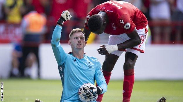 Dean Henderson celebrates saving Rice's penalty