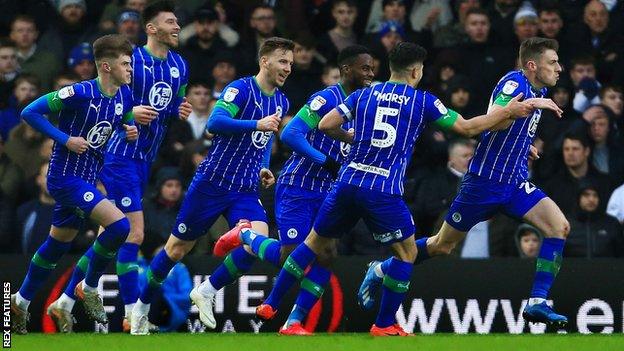 Wigan Athletic celebrate Joe Williams' goal at Elland Road