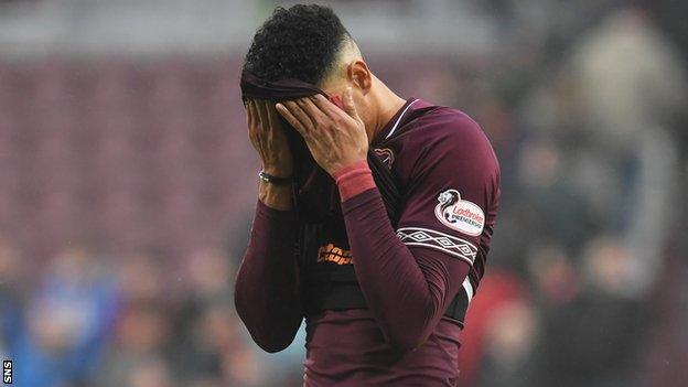 Sean Clare cuts a dejected figure after Hearts lose to Hibernian