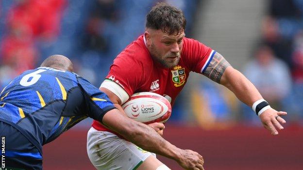 Rory Sutherland runs with the ball