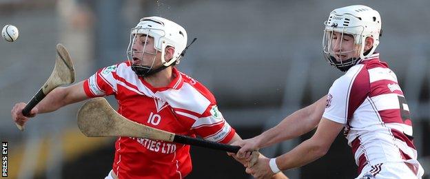 Slaughtneil's Meehaul McGrath battles with Loughgiel's Maol Connolly