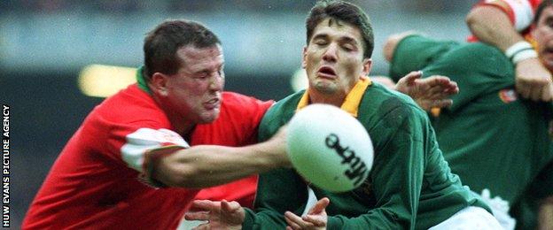 Joost van der Westhuizen in action against Wales' Garin Jenkins in 1994