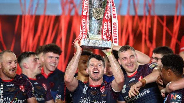 Lachlan Coote with the Super League trophy