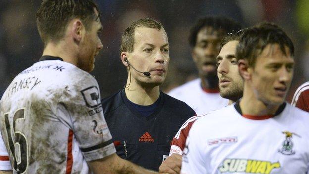 Referee Willie Collum surrounded the players at the final whistle