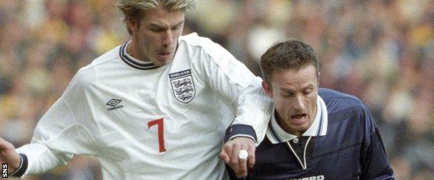 England's David Beckham challenges Scotland's Kevin Gallacher