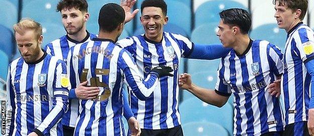 Liam Palmer celebrates with teammates