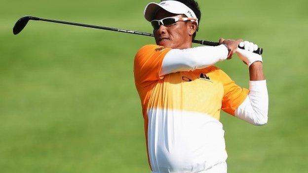 Thongchai Jaidee of Thailand plays a shot during the final round of the European Open