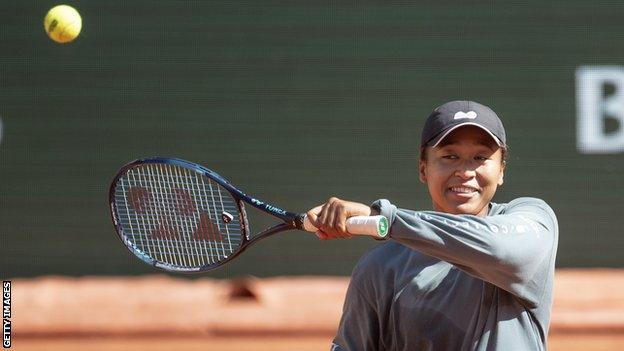 Naomi Osaka hits a ball in practice at the 2022 French Open