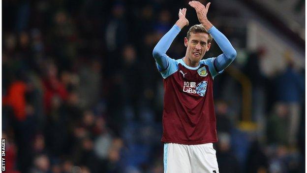 Crouch applauds the Burnley fans at Turf Moor, 2019.