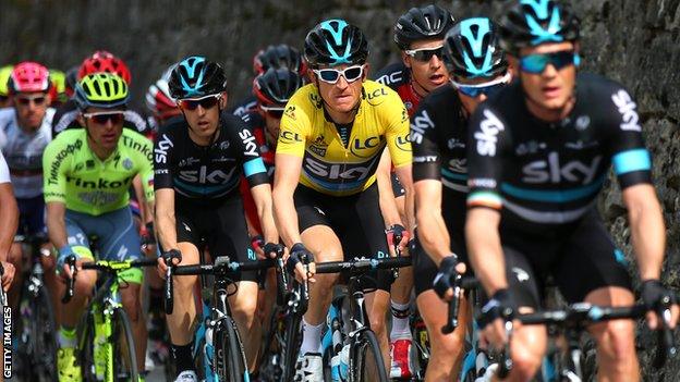 Geraint Thomas (yellow jersey) with Team Sky team-mates at the head of the Peloton during stage seven