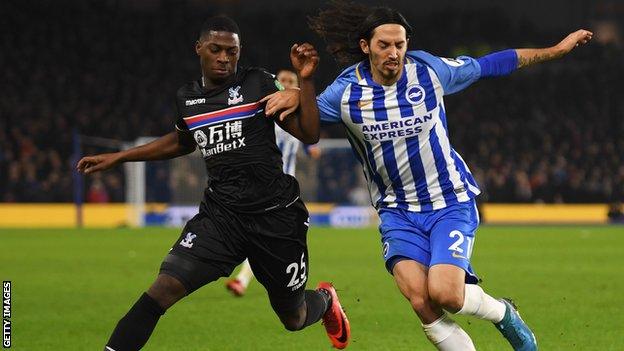 Sullay Kaikai battles for the ball with Brighton defender Matias Schelotto