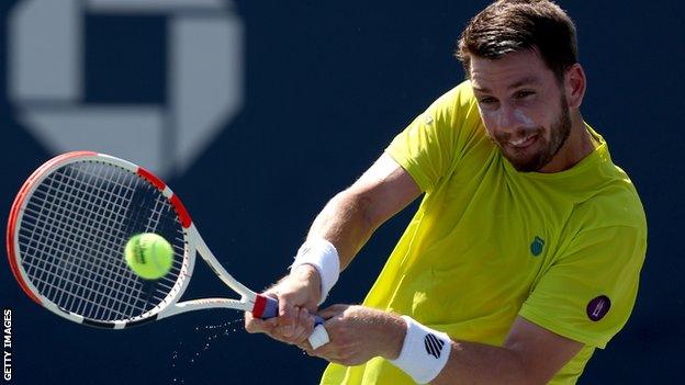 Cameron Norrie hits a return against Benoit Paire in the 2022 US Open match