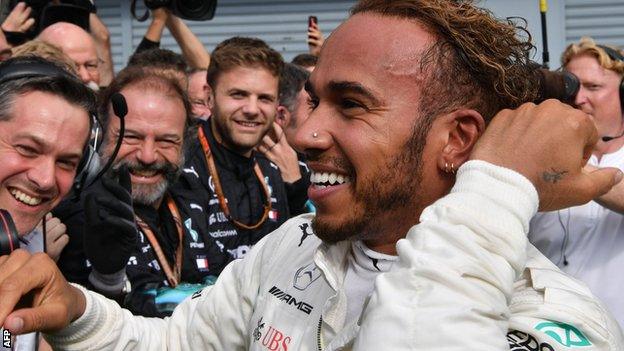 Lewis Hamilton celebrates winning the Italian GP