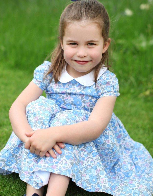 Princess-Charlotte-poses-in-her-garden.