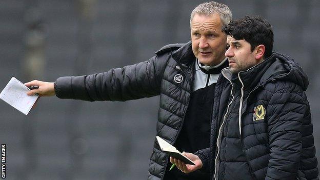 Dan Micciche (right) and Keith Millen discuss tactics