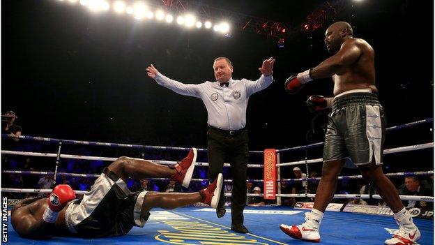 Referee Howard Foster signals the end as Chisora dispatches the durable Takam