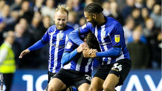 Adam Reach celebrates with team mates Barry Bannan and Michael Hector
