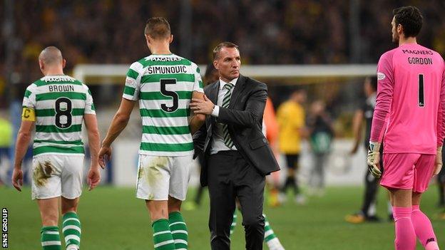 Celtic manager Brendan Rodgers consoles his players at full time in the Olympic Stadium