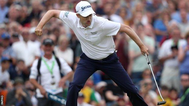 Russell Knox celebrates holing the winning putt on the 18th hole