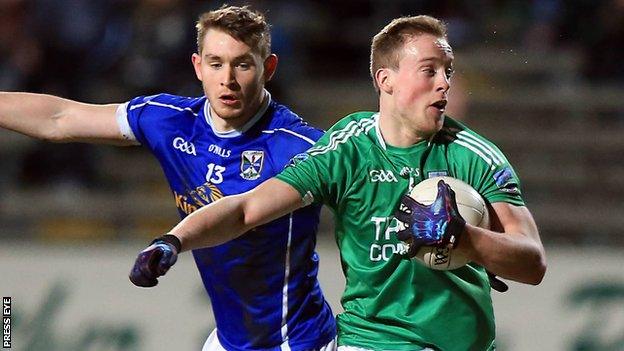 Cavan's David Givney battles with Fermanagh's Che Cullen