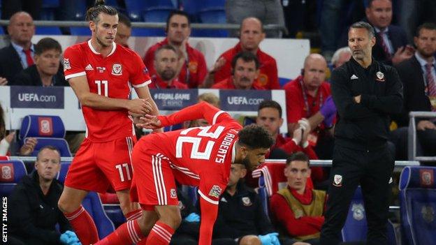 Tyker Roberts (centre) with Gareth Bale and Ryan Giggs