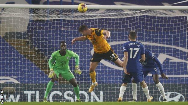 Wolves player Leander Dendoncker heads a chance wide during his side's Premier League game with Chelsea at Stamford Bridge