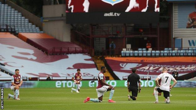 Aston Villa and Sheffield United players take a knee prior to kick-off