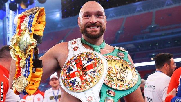 Tyson Fury holds WBC belts