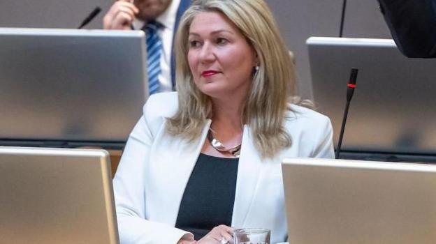 Laura Anne Jones sat in the Senedd chamber.